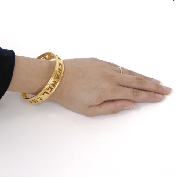 CHANEL Gold Cut Out Logo Bangle - Picture 9 of 10